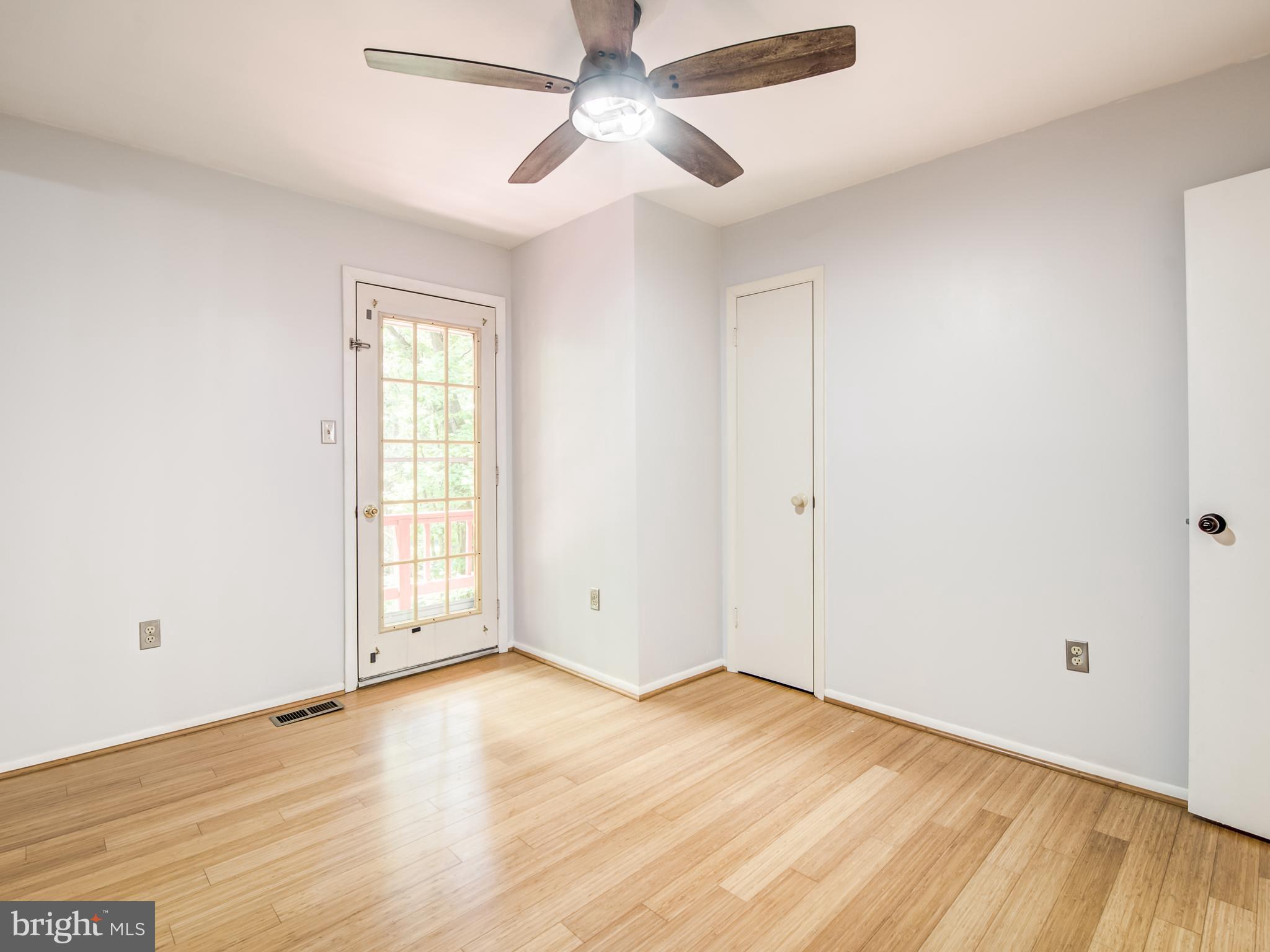 3330 Holland Cliffs Road Huntingtown, MD 20639 - Photo 19 of 64 Br 2 w/ceiling fan & door to balcony