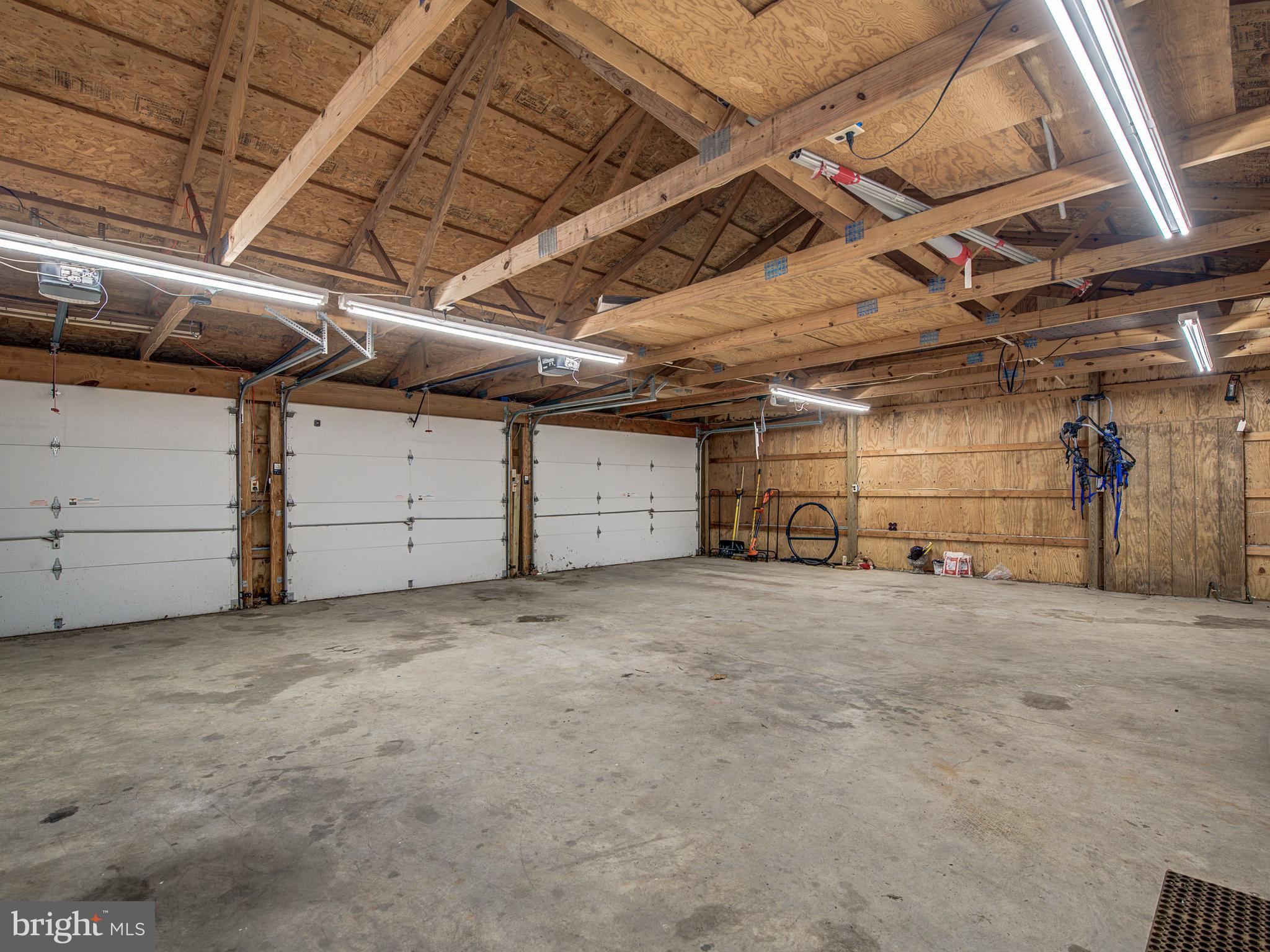 3330 Holland Cliffs Road Huntingtown, MD 20639 - Photo 47 of 64 Garage w/3 door openers