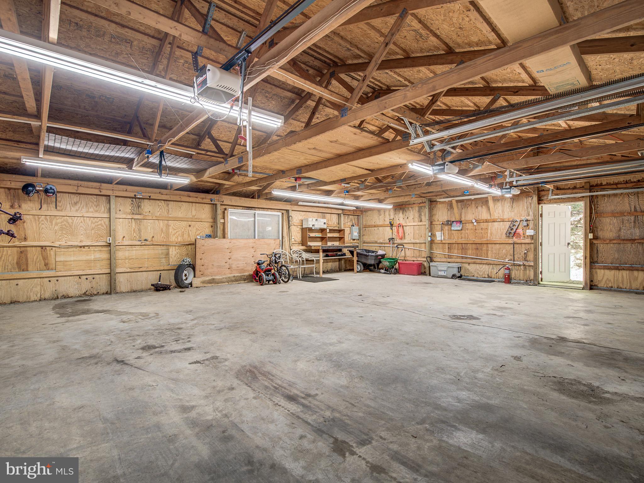 3330 Holland Cliffs Road Huntingtown, MD 20639 - Photo 48 of 64 Garage with rear door