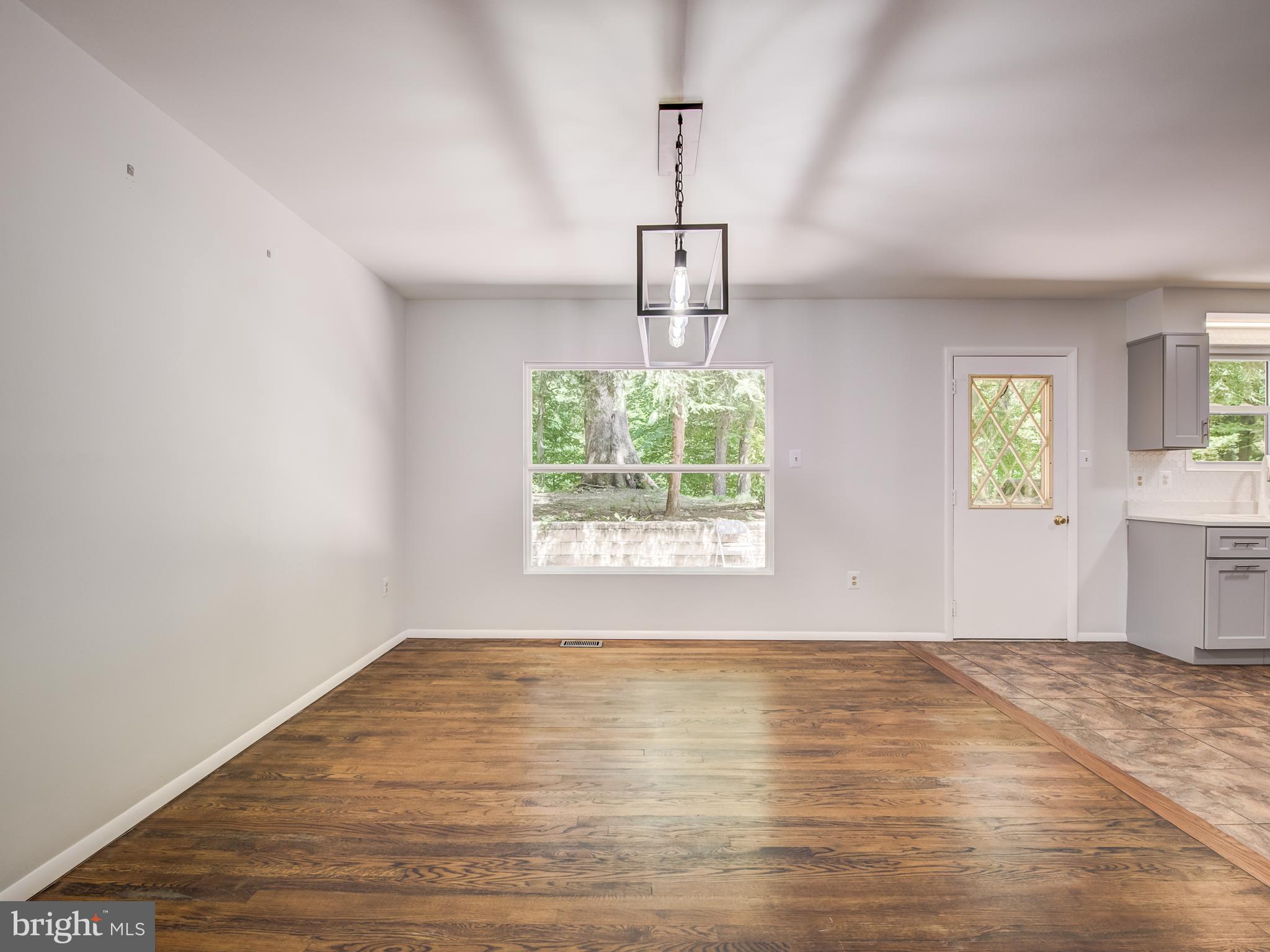 3330 Holland Cliffs Road Huntingtown, MD 20639 - Photo 8 of 64 Dining Room w/Large window brings nature indoors
