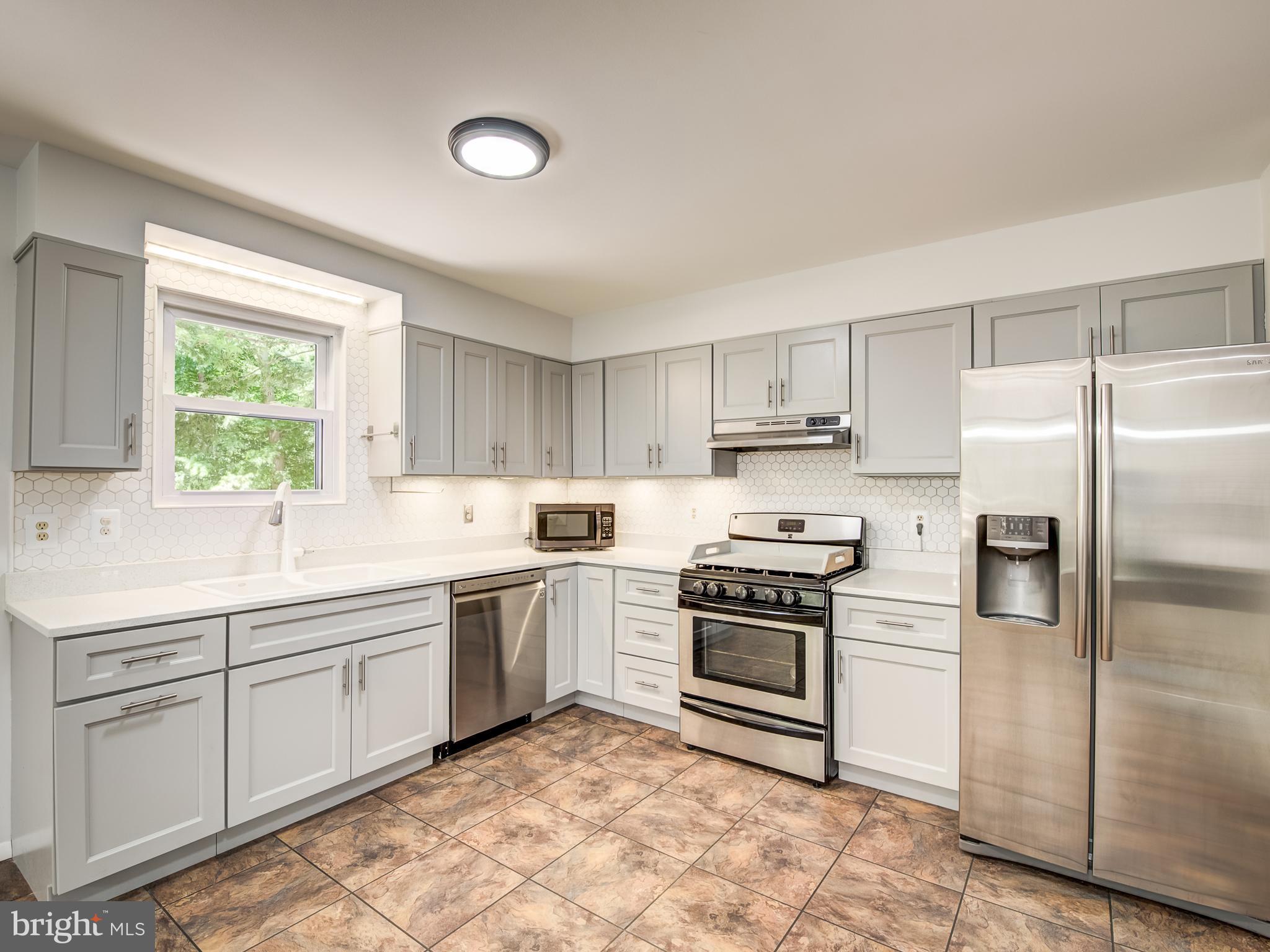3330 Holland Cliffs Road Huntingtown, MD 20639 - Photo 10 of 64 Kitchen w/quartz, S/S, appl. pantry