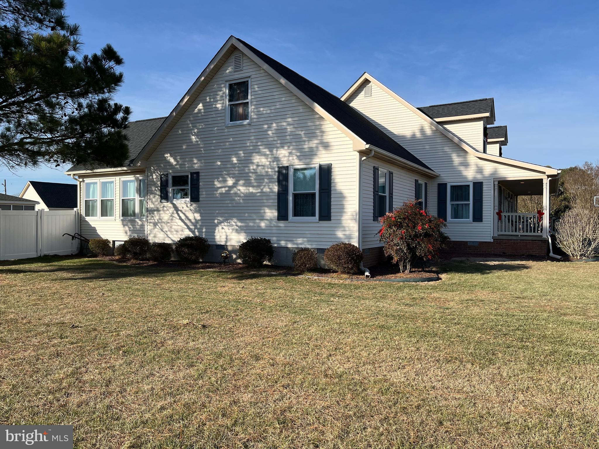 36744 Robin Hood Road Delmar, DE 19940 - Photo 3 of 69 a front view of a house with a yard