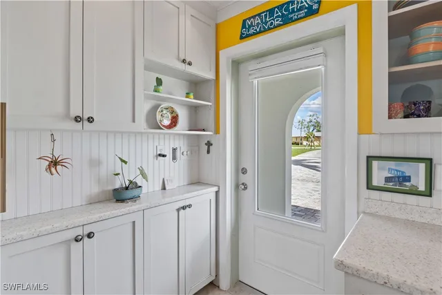 a view of cabinets and a window in a kitchen