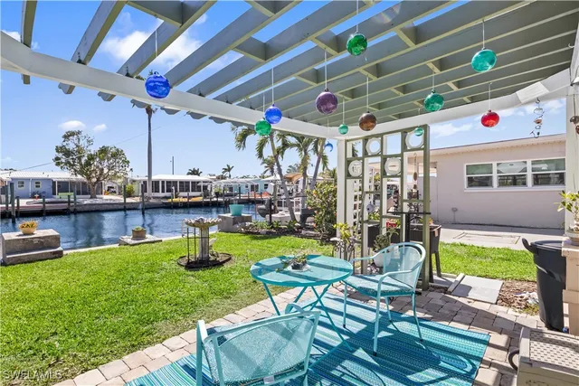 a view of yard with patio