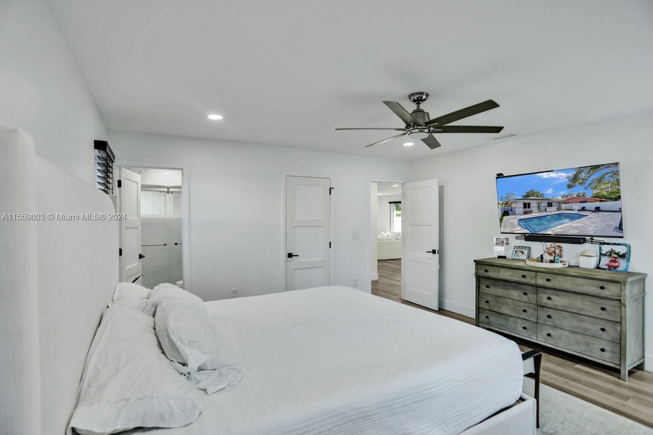 2800 Southwest 26th Street Miami, FL 33133 - Photo 11 of 72 a bedroom with a bed and a ceiling fan