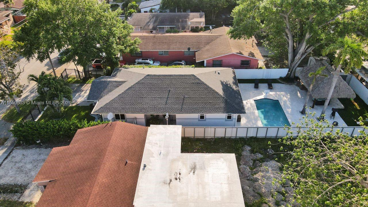 2800 Southwest 26th Street Miami, FL 33133 - Photo 23 of 72 an aerial view of a house with swimming pool and large trees