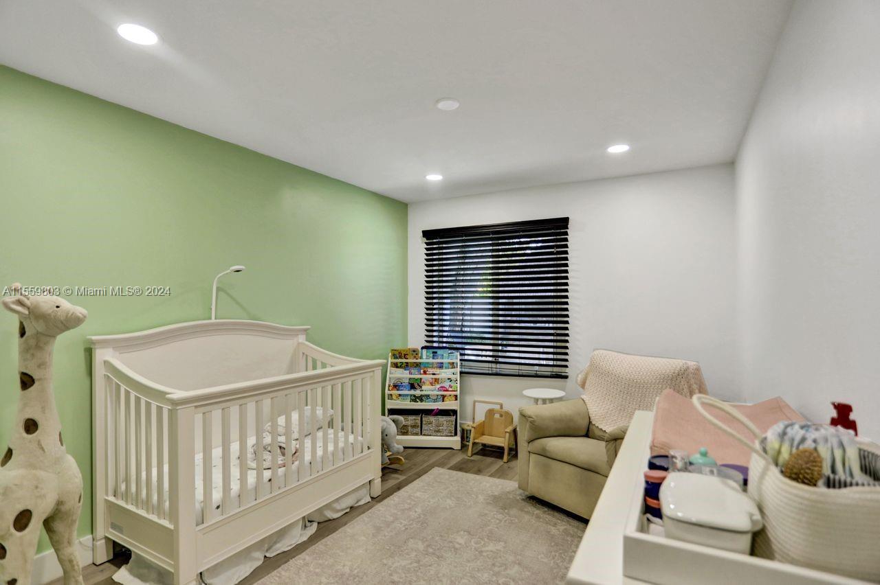 2800 Southwest 26th Street Miami, FL 33133 - Photo 4 of 72 a bedroom with furniture and a window