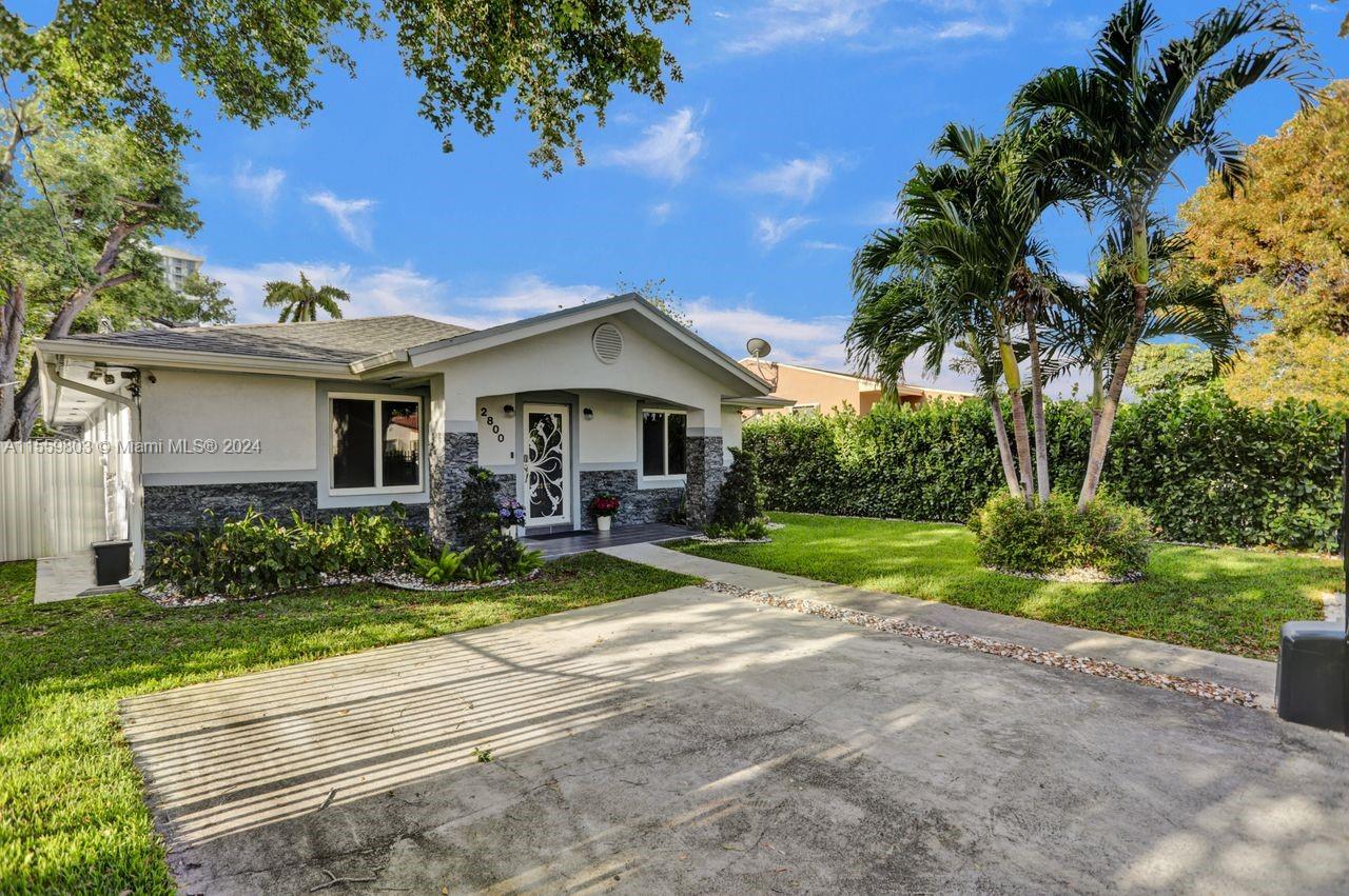 2800 Southwest 26th Street Miami, FL 33133 - Photo 43 of 72 a view of a house with backyard and sitting area