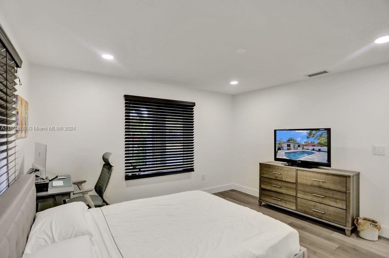 2800 Southwest 26th Street Miami, FL 33133 - Photo 48 of 72 a bedroom with a bed and a dresser