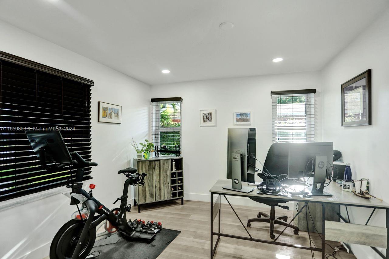 2800 Southwest 26th Street Miami, FL 33133 - Photo 52 of 72 a view of a workspace with furniture and a window