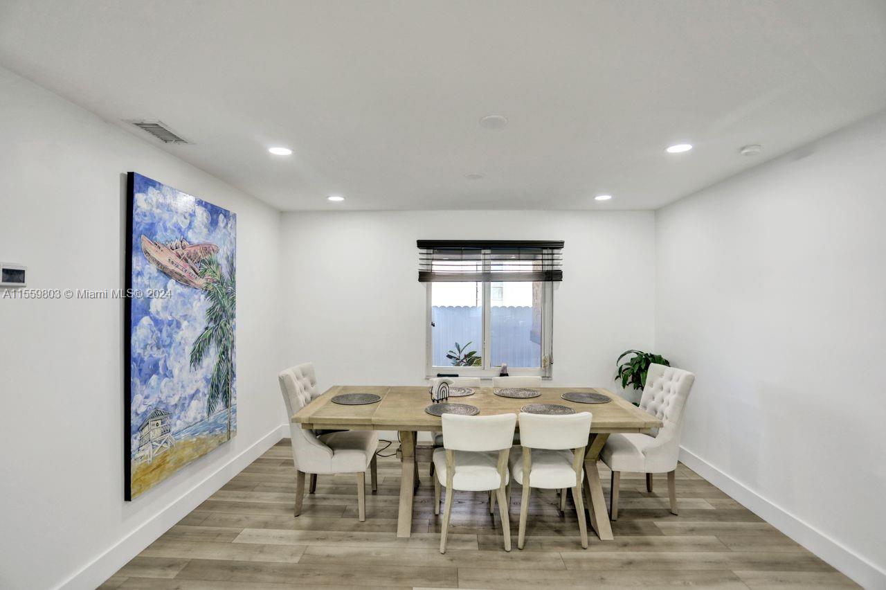 2800 Southwest 26th Street Miami, FL 33133 - Photo 58 of 72 a view of a dining room with furniture and wooden floor