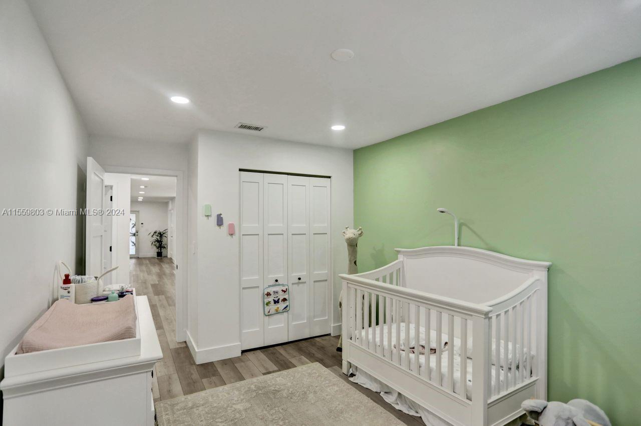 2800 Southwest 26th Street Miami, FL 33133 - Photo 6 of 72 a bedroom with a bed and a table