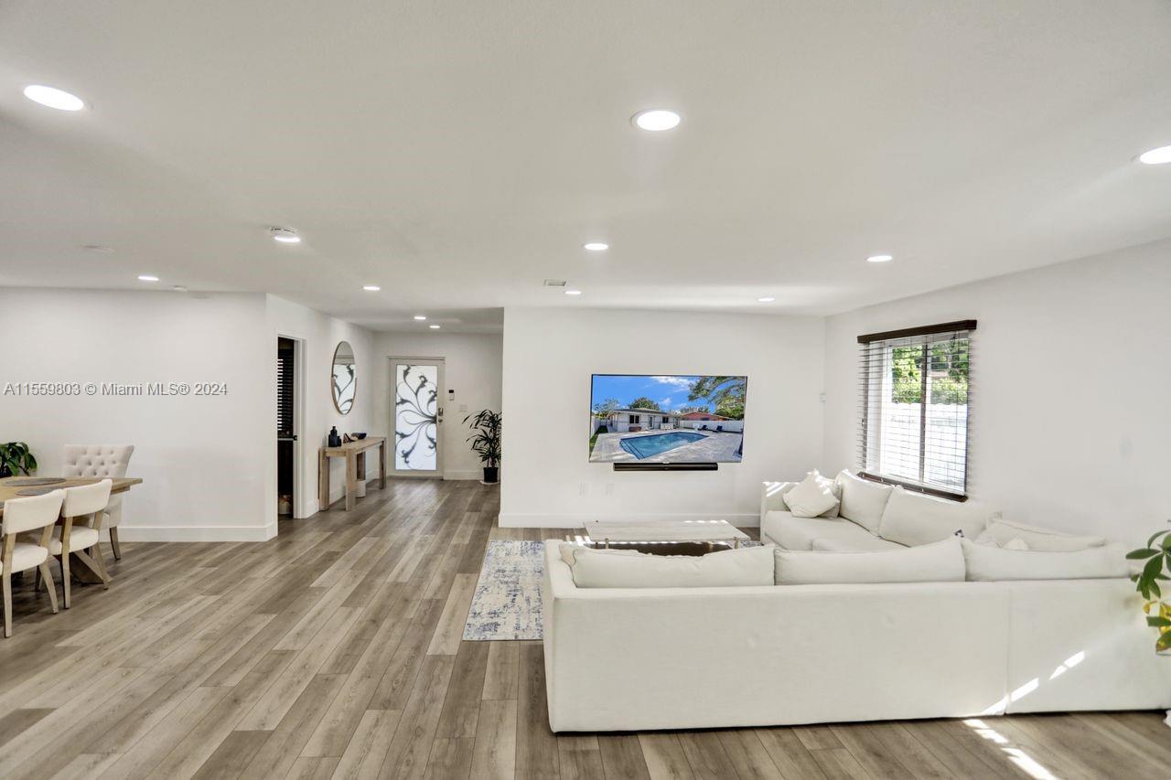 2800 Southwest 26th Street Miami, FL 33133 - Photo 62 of 72 a living room with furniture and a flat screen tv
