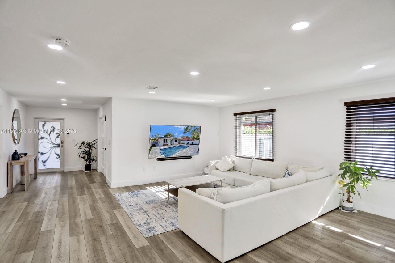 2800 Southwest 26th Street Miami, FL 33133 - Photo 64 of 72 a living room with furniture and a flat screen tv