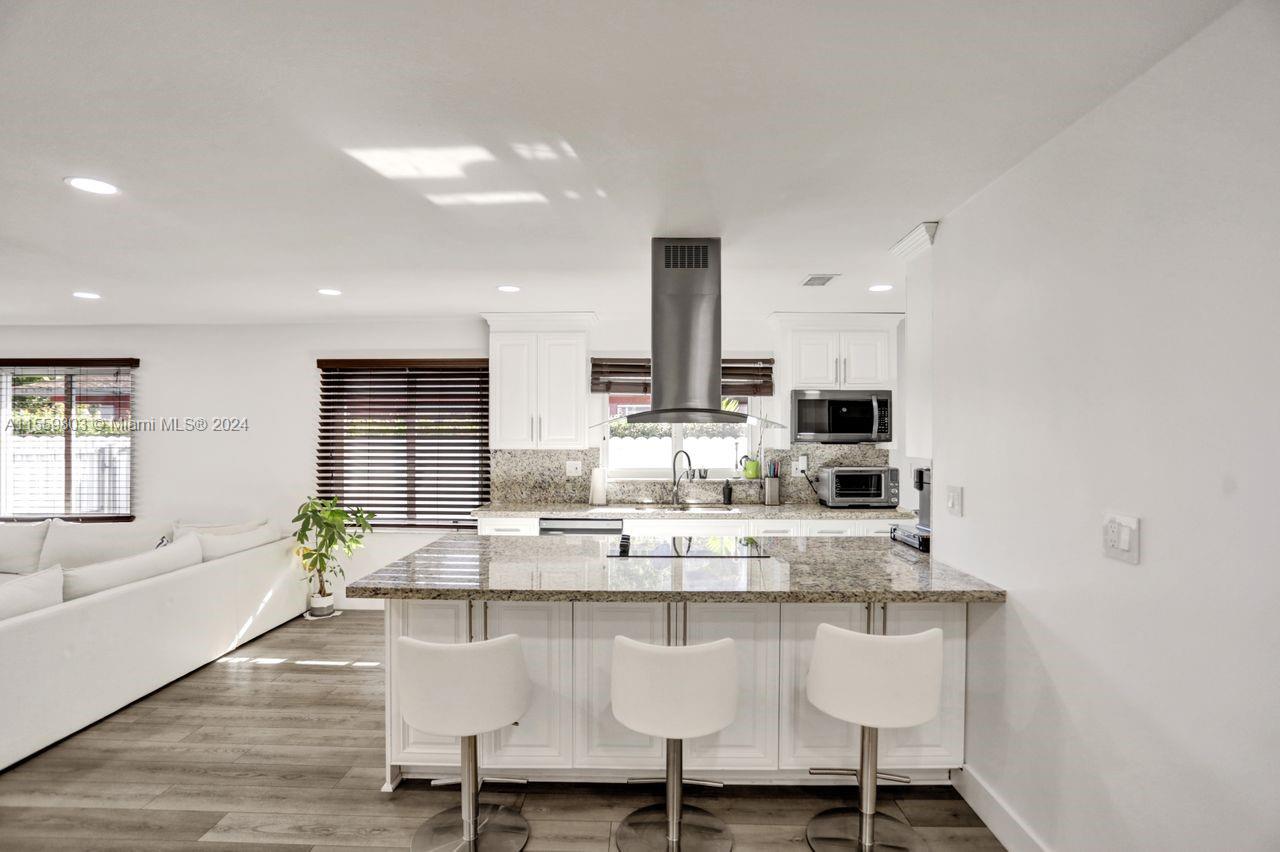 2800 Southwest 26th Street Miami, FL 33133 - Photo 66 of 72 a dining room with furniture and wooden floor