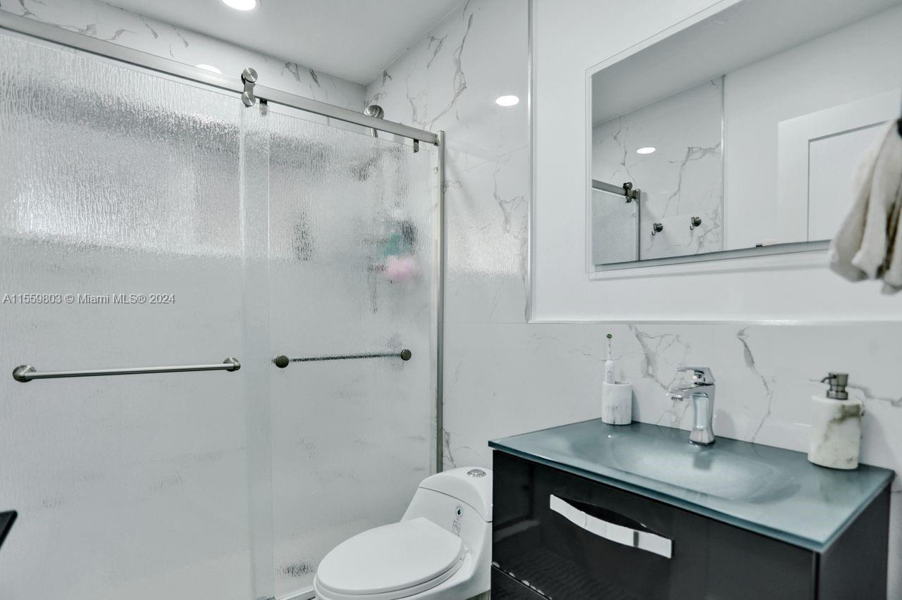 2800 Southwest 26th Street Miami, FL 33133 - Photo 69 of 72 a bathroom with a sink toilet and shower