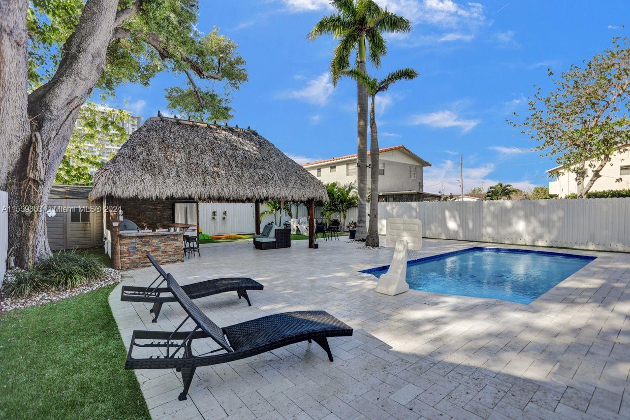 2800 Southwest 26th Street Miami, FL 33133 - Photo 72 of 72 a view of a backyard with a patio and fire pit