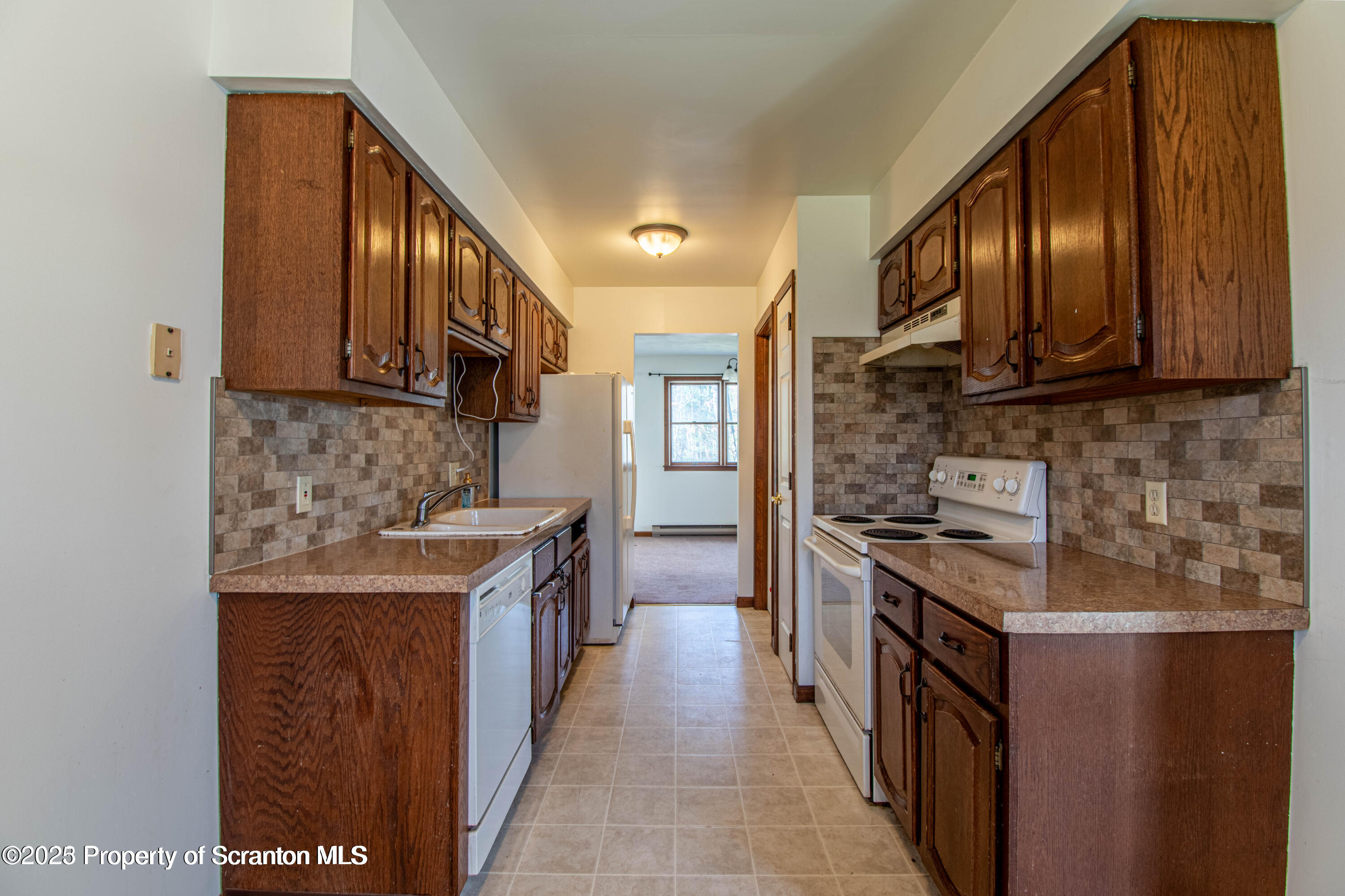a kitchen with stainless steel appliances granite countertop a stove and a sink