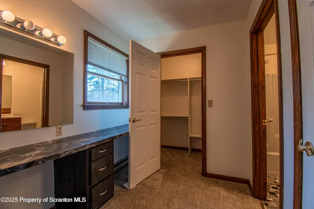 a view of cabinets and window