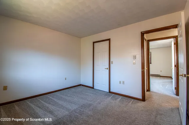 an empty room with closet area