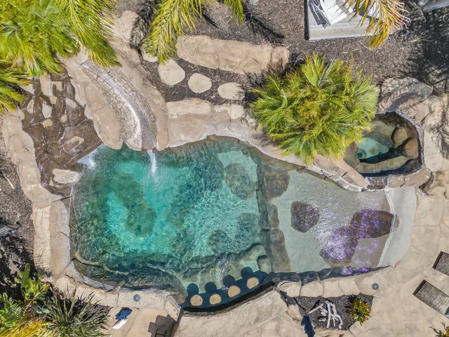 a view of a house with a yard and plants