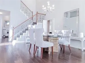 a view of hall way with furniture and staircase