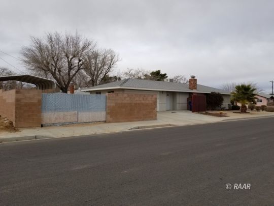 301 West Perdew Avenue Ridgecrest, CA 93555 - Photo 4 of 17 a night view of a house with a street