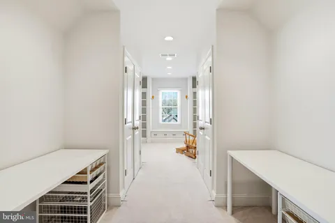 a living room with furniture and white walls