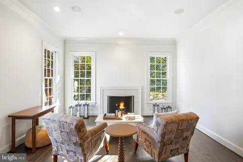 a view of a dining room with furniture wooden floor and chandelier