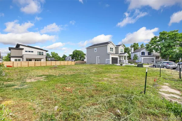 a house view with swimming pool and trees in the background