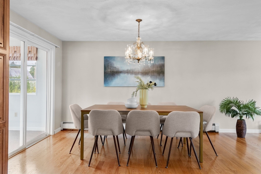 5 Brae Circle Woburn, MA 01801 - Photo 13 of 40 a view of a dining room with furniture wooden floor and chandelier