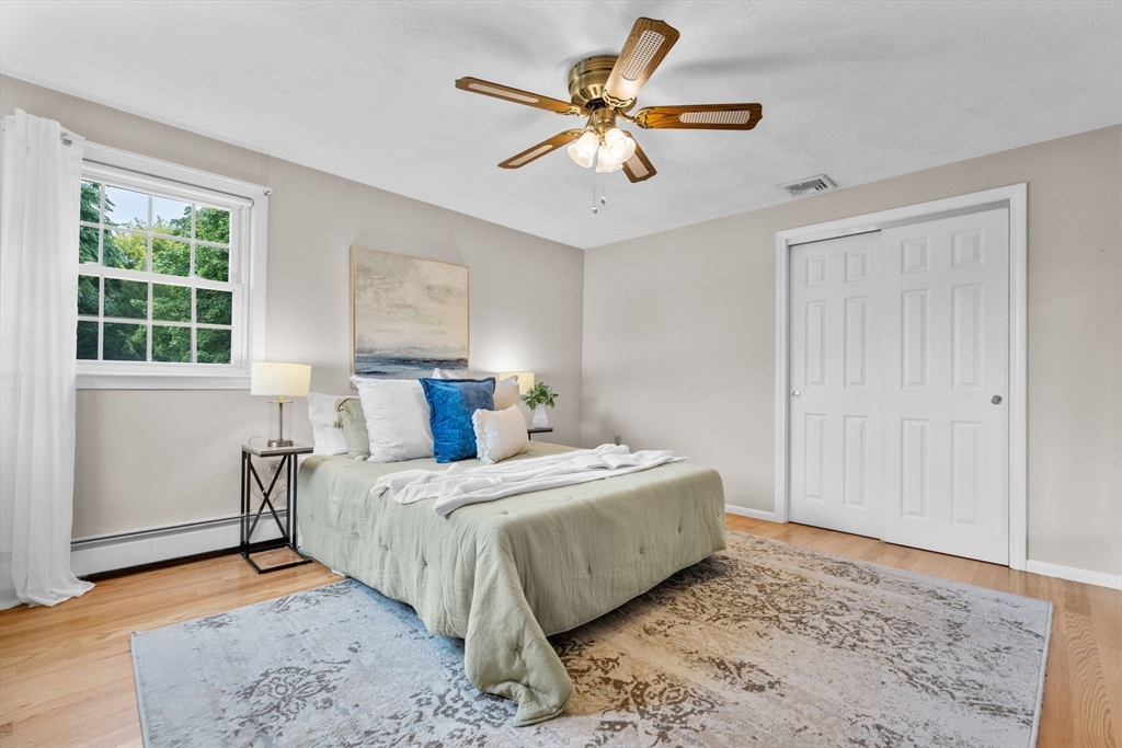 5 Brae Circle Woburn, MA 01801 - Photo 19 of 40 a bedroom with a bed and a window