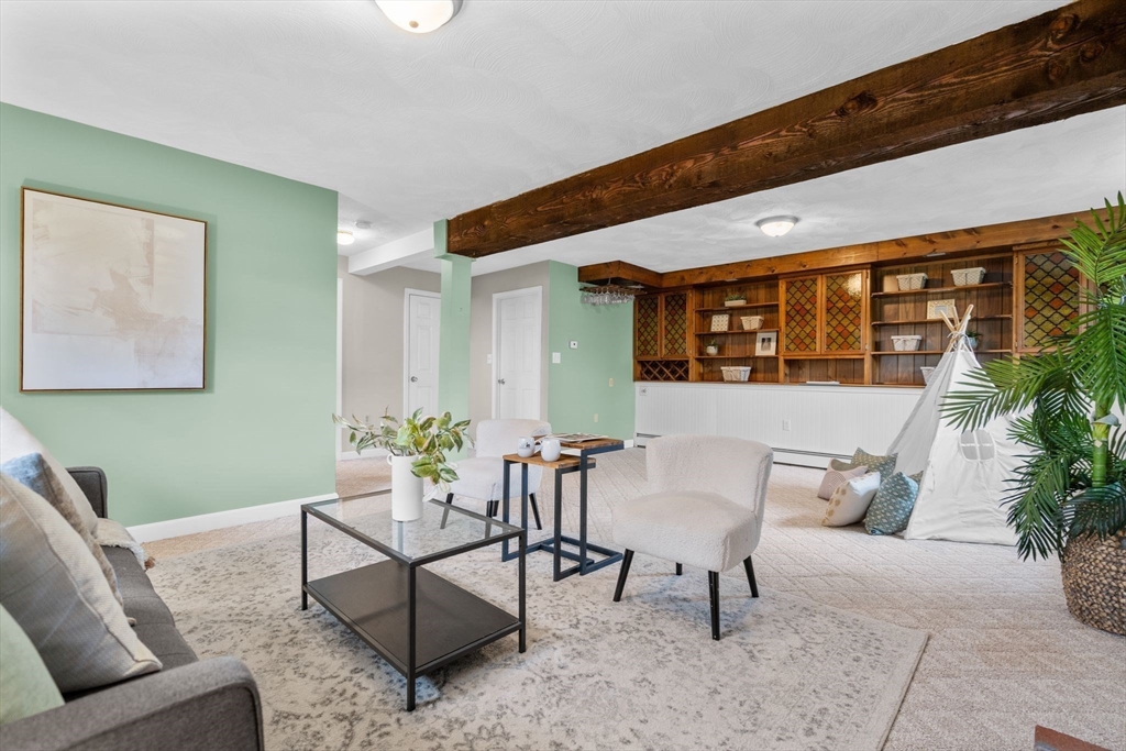 5 Brae Circle Woburn, MA 01801 - Photo 28 of 40 a living room with furniture and windows