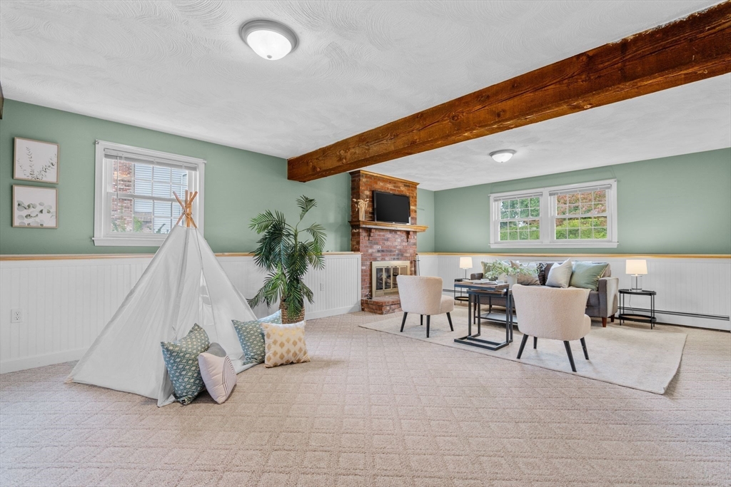 5 Brae Circle Woburn, MA 01801 - Photo 29 of 40 a living room with furniture and a window