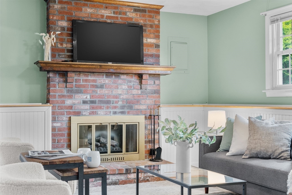 5 Brae Circle Woburn, MA 01801 - Photo 30 of 40 a living room with furniture and a fireplace