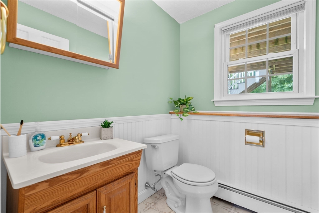 5 Brae Circle Woburn, MA 01801 - Photo 33 of 40 a bathroom with a sink a toilet and a window