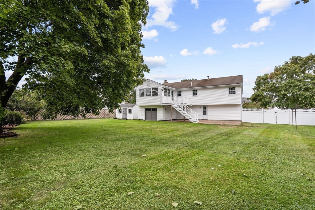 5 Brae Circle Woburn, MA 01801 - Photo 36 of 40 a view of a house with a big yard and large trees