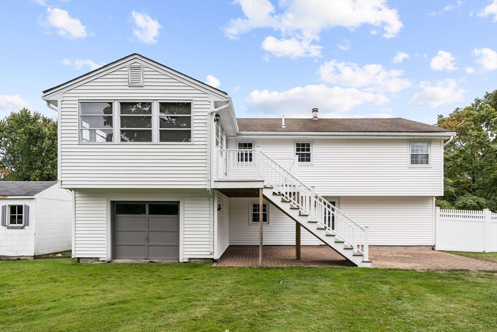 5 Brae Circle Woburn, MA 01801 - Photo 38 of 40 a front view of a house with a yard