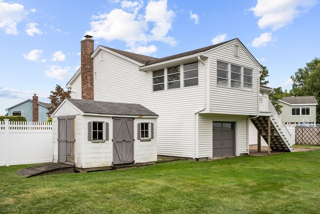 5 Brae Circle Woburn, MA 01801 - Photo 39 of 40 a front view of a house with a yard
