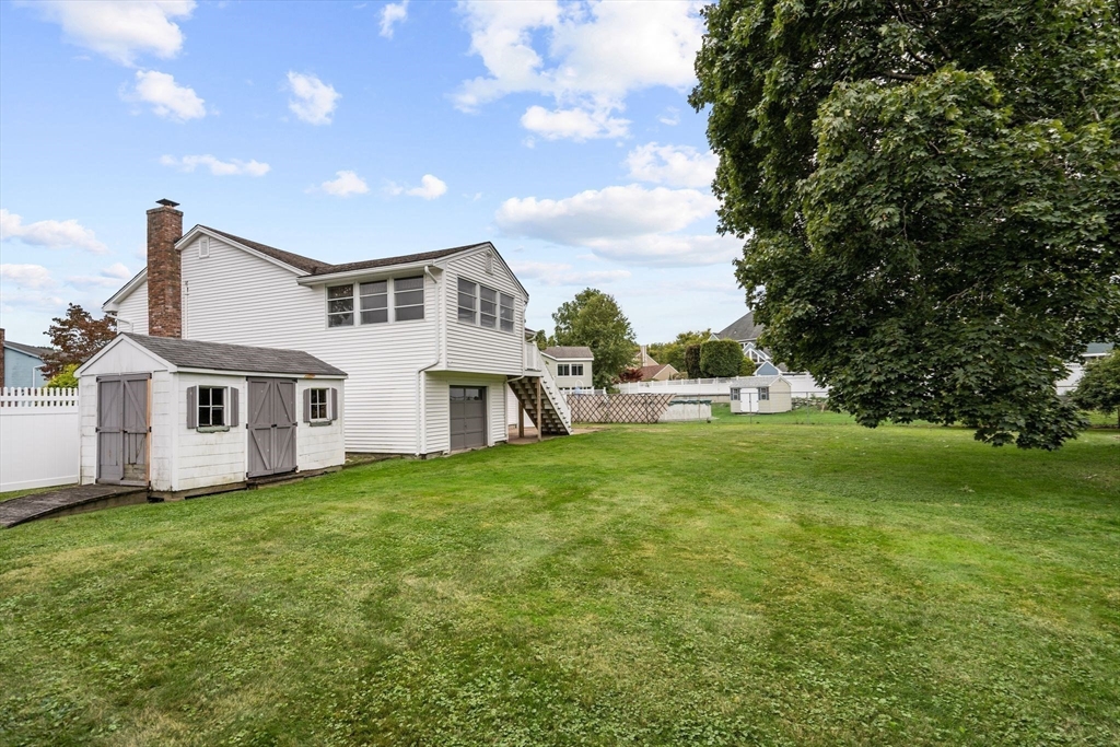 5 Brae Circle Woburn, MA 01801 - Photo 40 of 40 a front view of a house with a yard
