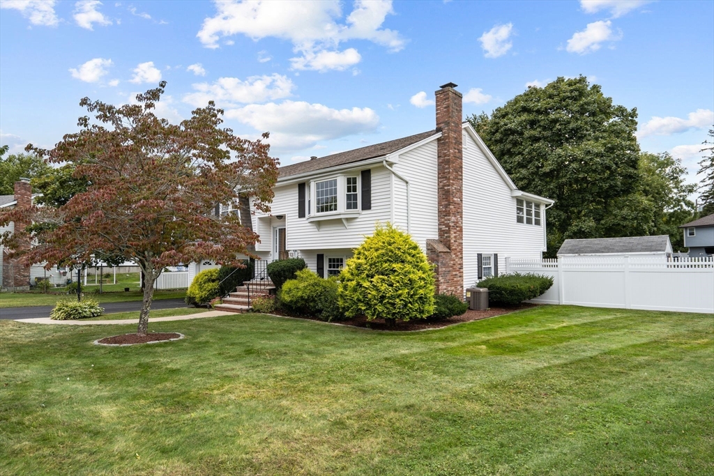 5 Brae Circle Woburn, MA 01801 - Photo 4 of 40 a front view of a house with garden