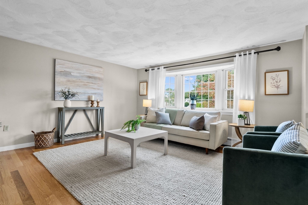 5 Brae Circle Woburn, MA 01801 - Photo 5 of 40 a living room with furniture and a window