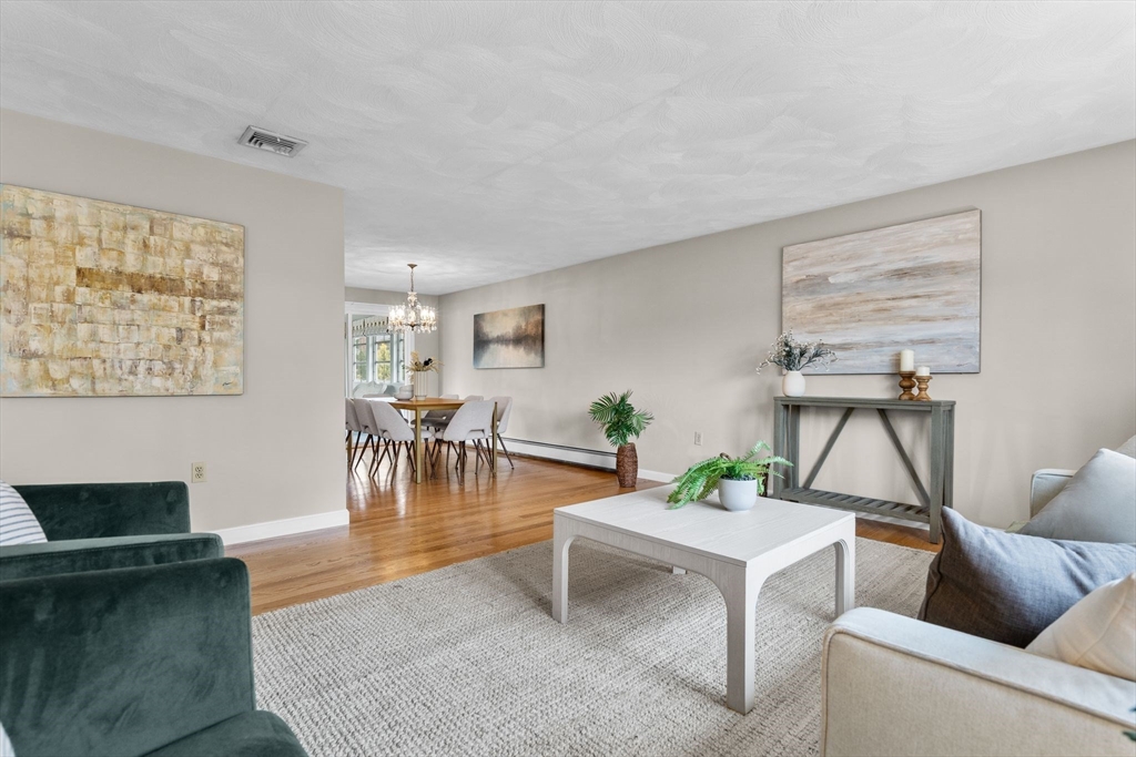5 Brae Circle Woburn, MA 01801 - Photo 6 of 40 a living room with furniture and a table