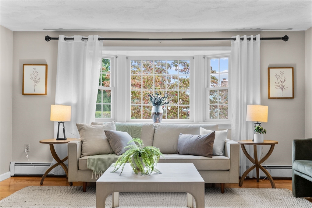 5 Brae Circle Woburn, MA 01801 - Photo 7 of 40 a living room with furniture and a large window