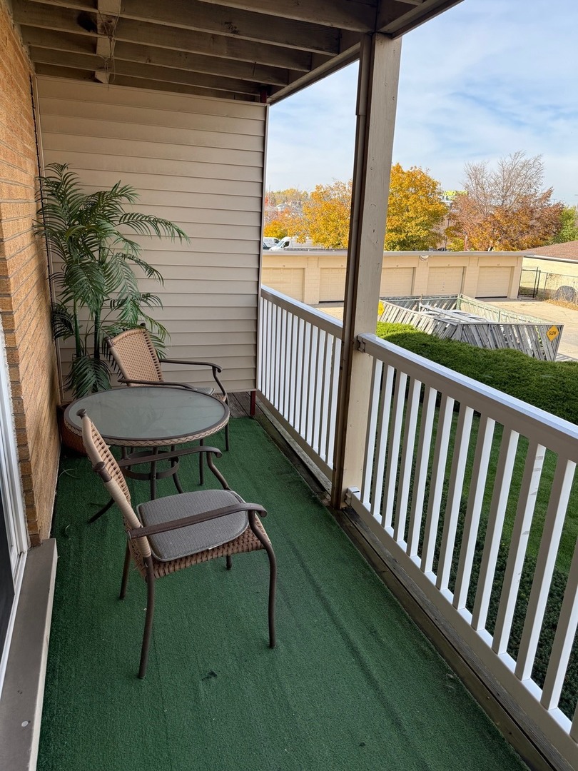 910 Beau Drive, Unit 211 Des Plaines, IL 60016 - Photo 11 of 11 a view of a balcony with chairs