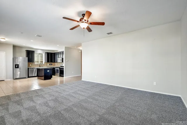 a view of a kitchen with a sink cabinets and window