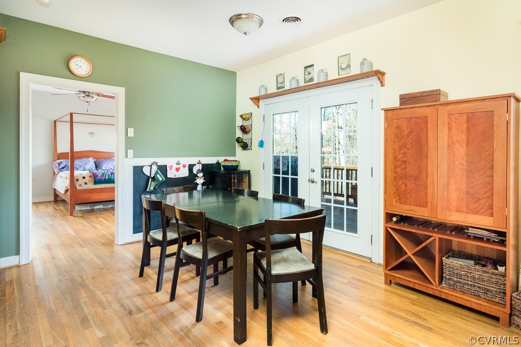 12620 Singer Road Midlothian, VA 23112 - Photo 11 of 28 a view of a dining room with furniture and wooden floor