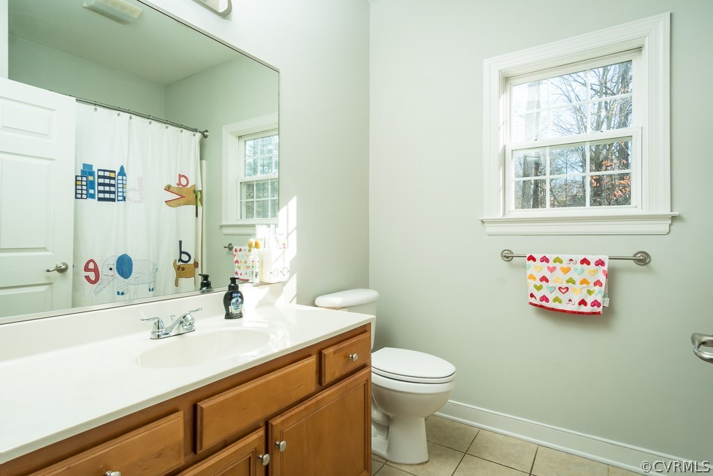 12620 Singer Road Midlothian, VA 23112 - Photo 18 of 28 a bathroom with a sink mirror and a toilet