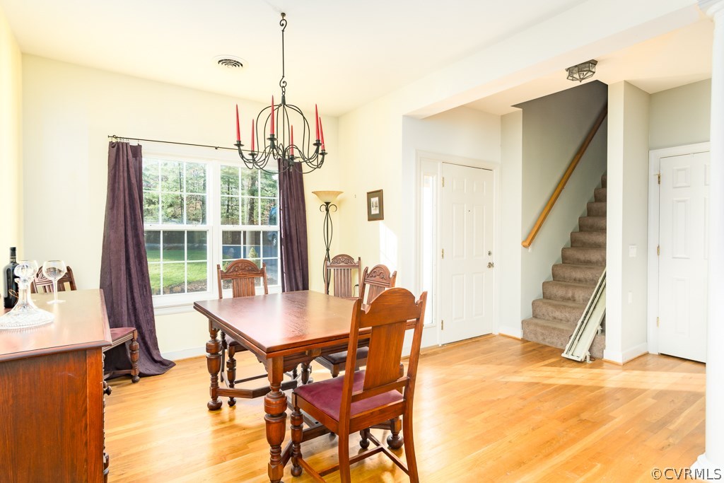 12620 Singer Road Midlothian, VA 23112 - Photo 4 of 28 a view of a dining room with furniture window and outside view