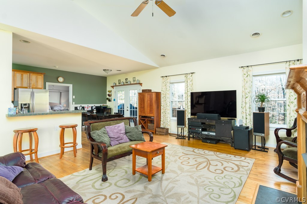 12620 Singer Road Midlothian, VA 23112 - Photo 7 of 28 a living room with furniture and a flat screen tv
